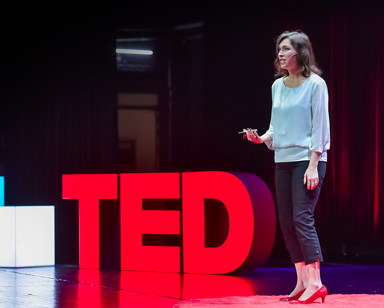 TED esports conference WCG 2019 Xi'an_a woman speaker and a big red TED sign on the stage